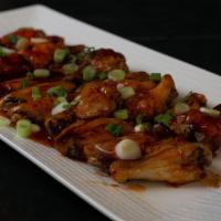 Honey Garlic · Wings mixed with our unique honey garlic sauce, topped with sesame seeds and scallions.
