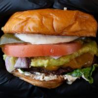 Mexican Burger · Single patty and guacamole, chopped onions, tomatoes, jalapeño, lettuce and special sauce.