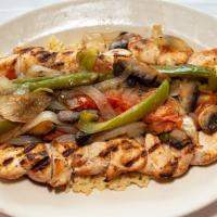 Chicken Shish Kebab · Skewers of marinated chicken or pork topped with peppers onions mushrooms and tomatoes. serv...