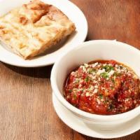 Meatballs · grass-fed beef and pork meatballs, tomato sauce, parmigiano and served with pizza bianca
