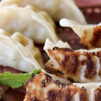 Gyoza (6)  · Pan fried shrimp dumplings served with soy vinegar and scallion dipping sauce.