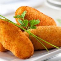 Potato Croquettes · 6 pieces of Bite-size potato croquettes baked with cheese.