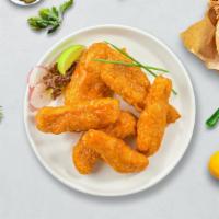 Buffalo Beast Tenders · Chicken tenders breaded and fried until golden brown before being tossed in buffalo sauce.