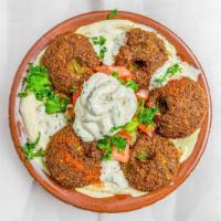 Falafel, Hummus & Salad · Vegetarian. Crushed chickpeas, fava beans mixed with cumin and coriander deep fried.