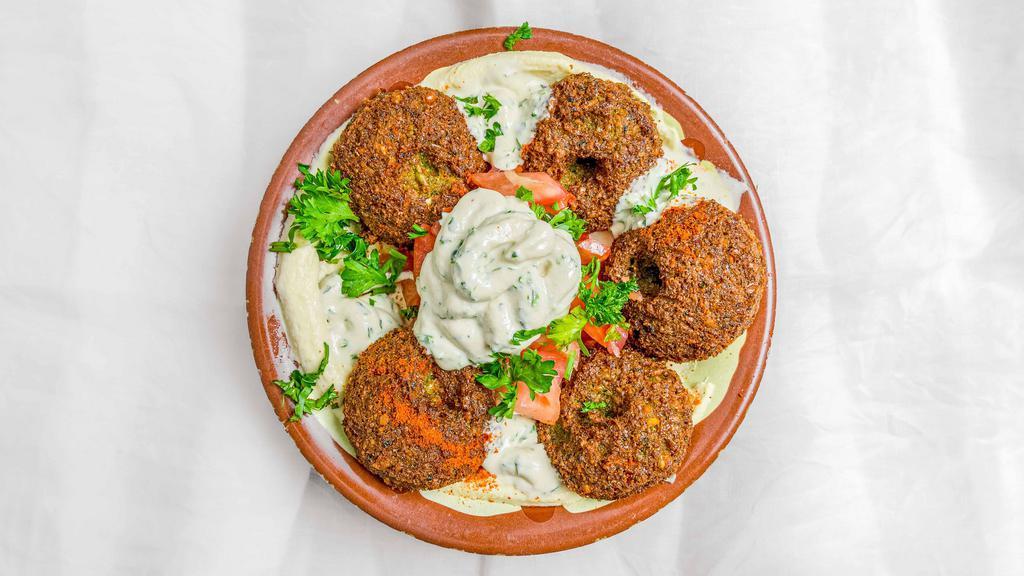 Falafel, Hummus & Salad · Vegetarian. Crushed chickpeas, fava beans mixed with cumin and coriander deep fried.