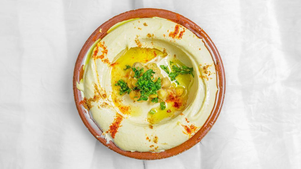 Hummus · Vegetarian. Chick peas dip with tahini garlic and juiced lemon.
