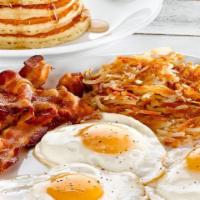 Tremendous Twelve™ · 3 eggs, 4 buttermilk pancakes, choice of crispy hash browns or breakfast potatoes, and your ...