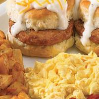 Country Sausage Biscuit Breakfast · Two fresh baked sausage biscuits topped with cream gravy and American cheese. Served with tw...