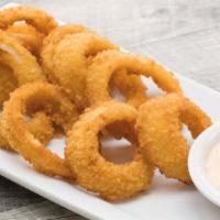 Onion Rings · Our batter fried jumbo onion rings are served with zesty chipotle ranch dipping sauce.