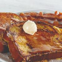 Brioche French Toast Platter · Two slices of thick-cut brioche bread dipped in our signature French toast batter, grilled, ...