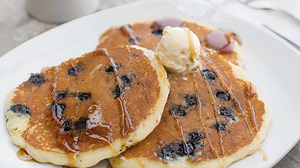Blueberry Buttermilk Pancakes · Three buttermilk pancakes loaded with juicy blueberries, grilled and sprinkled with powdered sugar. No sides. 570 cal