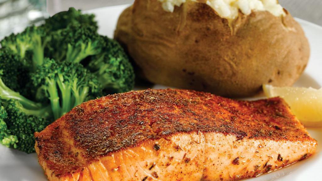 Grilled Salmon · Flaky, tender fillet Cajun or garlic seasoned and teriyaki glazed. Served with two dinner sides.