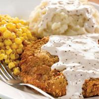 Country Fried Steak · Lightly breaded steak topped with our country-style cream gravy and served with two dinner s...