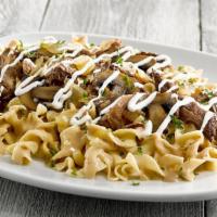 Pot Roast Stroganoff · Braised beef, mushrooms and onions served over tender egg noodles in a savory cream sauce wi...