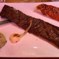 Tampiqueña · Tequila lime and rosemary marinated grilled skirt steak served with cheese enchilada cambray...