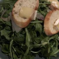 Arugula Salad · Candied walnuts, roasted shallots, dried cranberries, brie cheese crostini, and red wine vin...