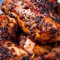 Jerk Chicken · Served with white rice or rice and peas! Also your choice of steam vegetables or fresh salad
