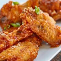 Bbq Wings · Served with white rice or rice and peas! Also your choice of steam vegetables or fresh salad
