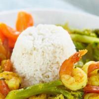 Curry Shrimp · Served with white rice or rice and peas! Also your choice of steam vegetables or fresh salad