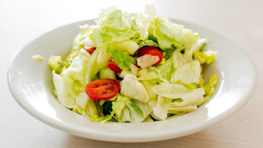House Salad · Iceberg lettuce, cucumber, sweet onion, and cherry tomatoes tossed in a red wine vinaigrette dressing.