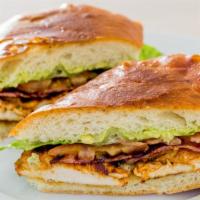 Chicken Breast Sandwich · Grilled chicken breast, mashed avocado, turkey bacon, lettuce, tomato and mayonnaise on a so...