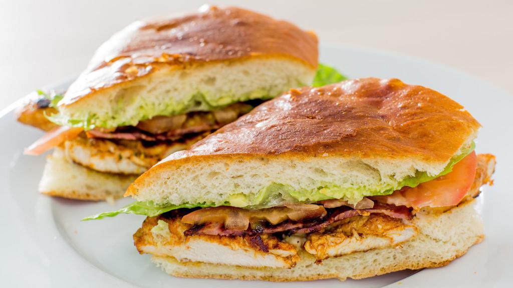 Chicken Breast Sandwich · Grilled chicken breast, mashed avocado, turkey bacon, lettuce, tomato and mayonnaise on a soft toasted brioche roll.