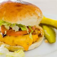 Chicken Burger · House ground white and dark meat chicken, served on a home-made brioche bun with lettuce, to...