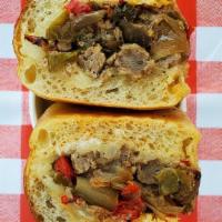 Sausage & Peppers Hero · Housemade italian sausage, provolone, roasted hot & sweet peppers, roasted onion, mayo on a ...