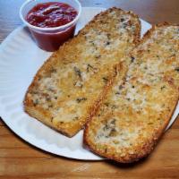 Garlic Bread · Housemade seeded bread topped and baked with garlic butter and pecorino. Served with a side ...