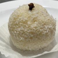 Beijinho · Coconut ball made with sweetened milk, covered with shredded coconut.