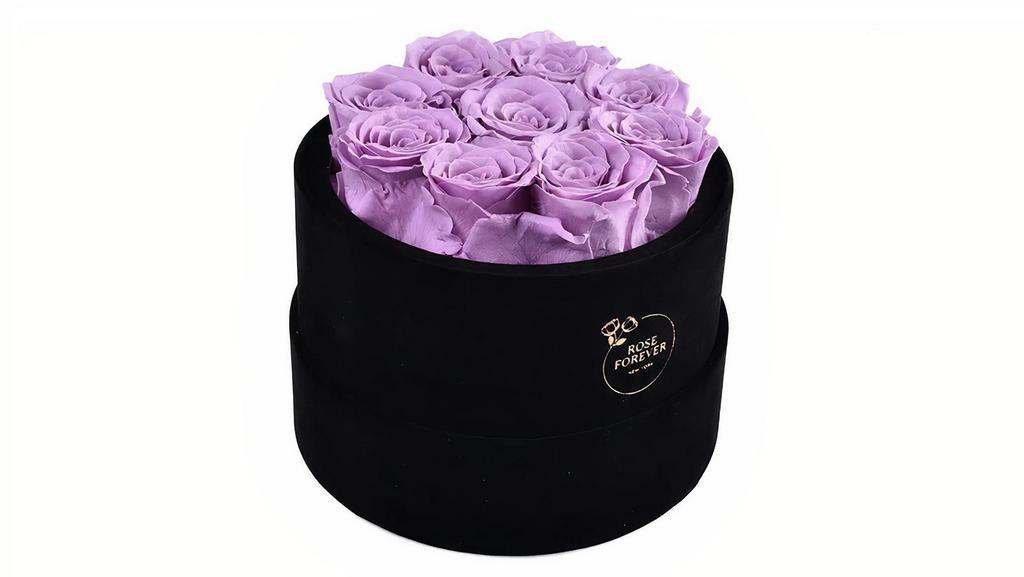 Forever Roses Lilac  Round Box · Each forever rose box is handcrafted.
All forever roses last a year.  
This Lilac rose bouquet has 9 gorgeous preserved roses that last for a year. 

To make each rose arrangement look fresh and elegant the best rose preservatives you can find on the market are used, and carefully arranged  in black, vegan velvet, Parisian hat boxes.

Quantity: 9 pink roses
5.5Hx7Rd