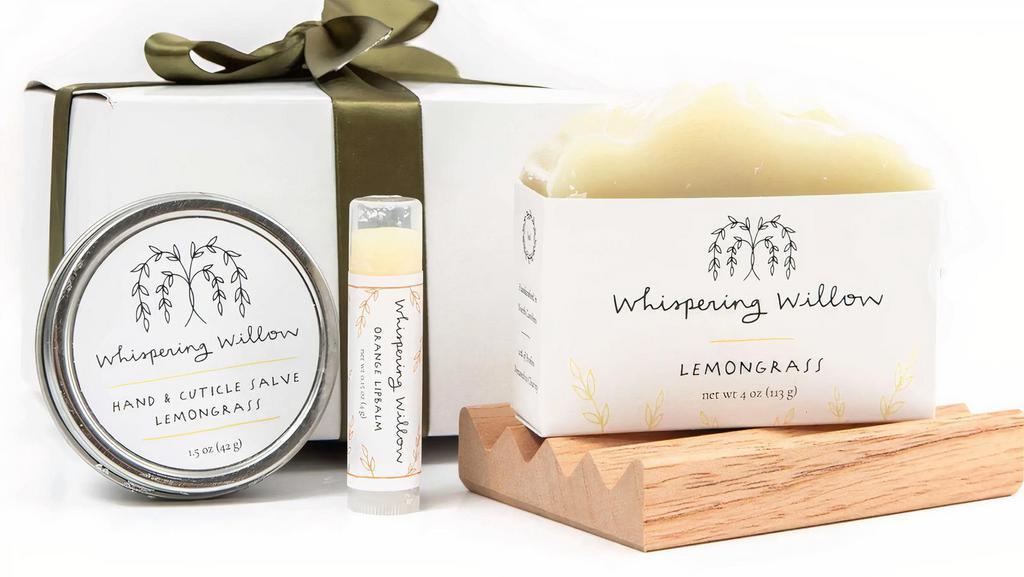 Mini Lemongrass 4Pc Spa Gift Box · Gift box includes a bar of soap, a lip balm, and a hand & cuticle salve along with a cedar soap dish.
White box with a satin ribbon bow.
Box measures 5