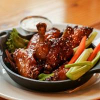 Wings · 6 or 12pc wings, with choice of spicy BBQ, buffalo, or teriyaki sauce. Served with carrots, ...