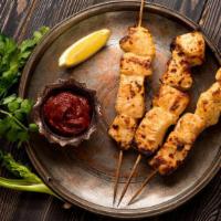 The Chicken Malai Kebab · Boneless chicken cubes marinated in mild herbs, sour cream, cashew nuts in famous charcoal o...