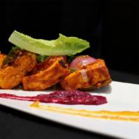The Paneer Tikka Tandoori · Cooked in clay oven, cottage cheese marinated in turmeric yogurt sauce with red peppers, gre...