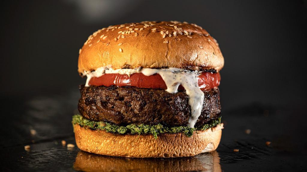 The Jani · Top seller. Black Angus, grass-fed, pasture-raised, prime ground beef patty, served on a sesame bun with grilled tomatoes, mint chutney, and yogurt.