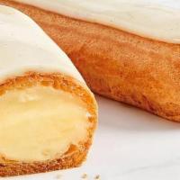 Éclairs À La Vanille (Vanilla Eclair) · Long choux pastry filled with vanilla custard cream and coated with confectioner's sugar ici...