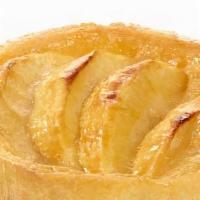 Tarte À La Pomme (Apple Tart)
 · Sweet tart dough filled with custard cream light and garnished with a hazelnut cream and fre...
