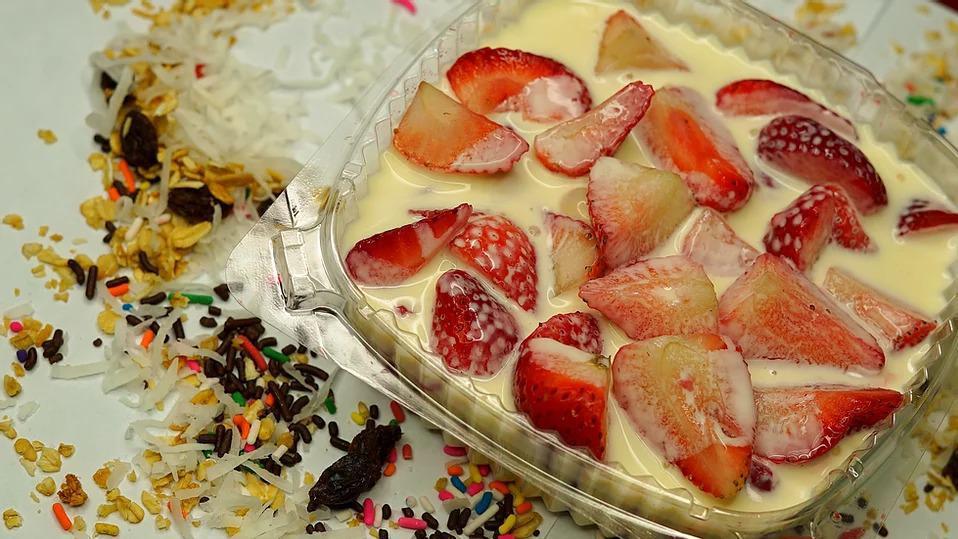 Strawberries & Cream · Fresh strawberries, coconut flakes, granola, rainbow or chocolate sprinkles, raisins, homemade sweet cream.