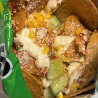 Tostiesquites · Tostitos, Esquites (corn), Mayonaisse, Kirby cucumbers, salt, lime, Cheese, Home Made Chile(...