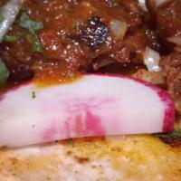 Al Pastor Taco · Roasted pork. Served with onions, cilantro, onions, radish, limes, and salsa on the side.