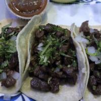 Bistec Taco · Steak. Served with onions, cilantro, onions, radish, limes, and salsa on the side.