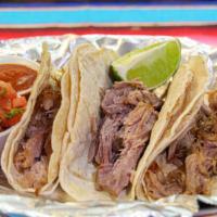 Carnitas Taco · Fried pork. Served with onions, cilantro, onions, radish, limes, and salsa on the side.