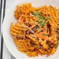 Banh Mi Frites · Twice fried waffle fries, pickled daikon and carrots, caramelized pork crumble, cilantro, an...