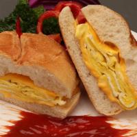 Egg & Meat Sandwich · Two Eggs choice of style, choice of meat, and your choice of bread.