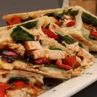 Milano Panini · Grilled Chicken, Sauteed Spinach, Roasted Red Peppers, and Mozzarella. Served with Cole Slaw...
