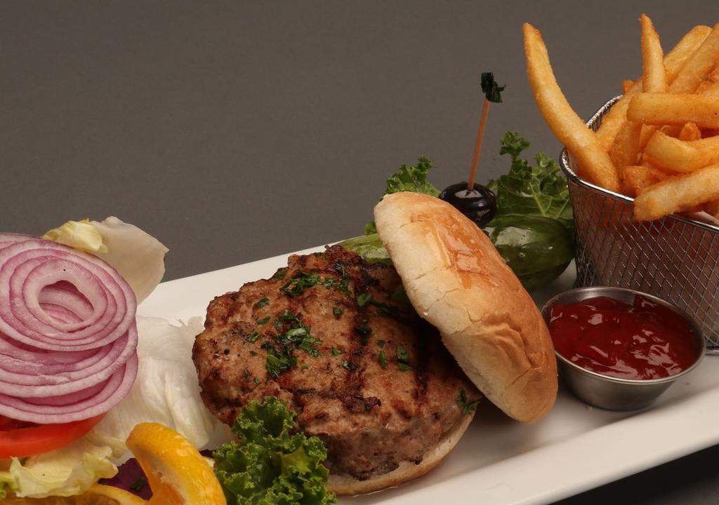 Turkey Burger · Our made in house Turkey Burger served with Fries and Pickles.