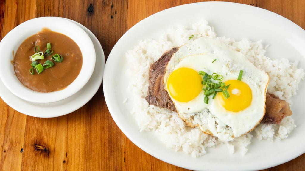 Loco Moké · The Local Favorite! Rib eye steak over a bed of rice topped with two eggs and brown gravy