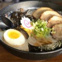 Classic Tonkotsu Ramen · Pork broth. Topped with braised pork belly, soft seasoned broiled egg, bamboo shoots,fish ca...