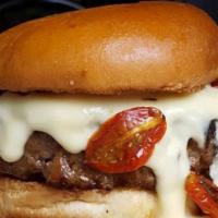 The Suprema Burger · short rib, brisket, iberico jamon bacon jam, black garlic sauce, aged cheddar, roasted tomat...
